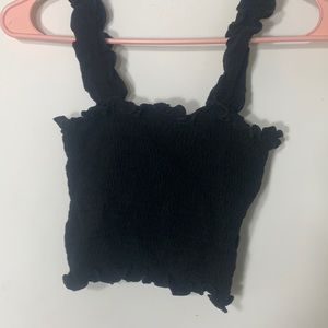this is a black ruffled crop top.